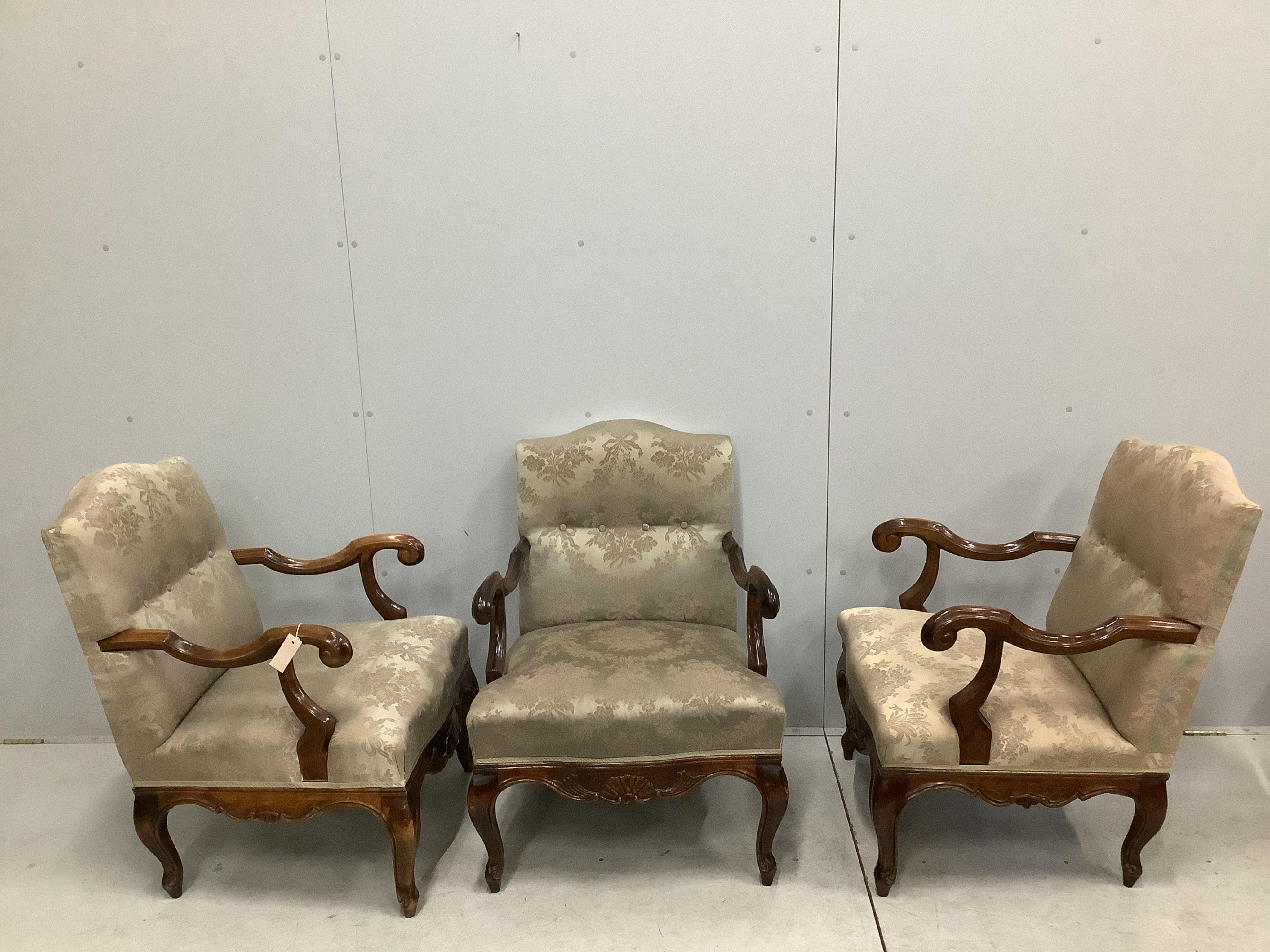 A set of three 18th century style carved walnut beech armchairs, width 59cm, depth 62cm, height 86cm. Condition - fair to good